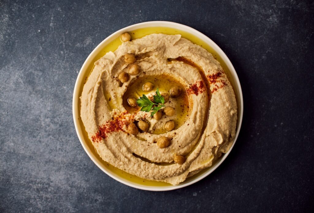 A bowl of hummus for dipping vegetables or pita bread.