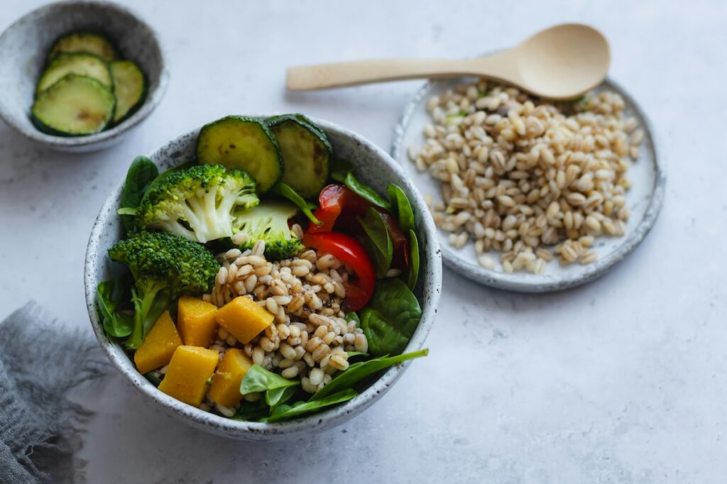 Consume a plate filled with foods with vitamins for gut health.