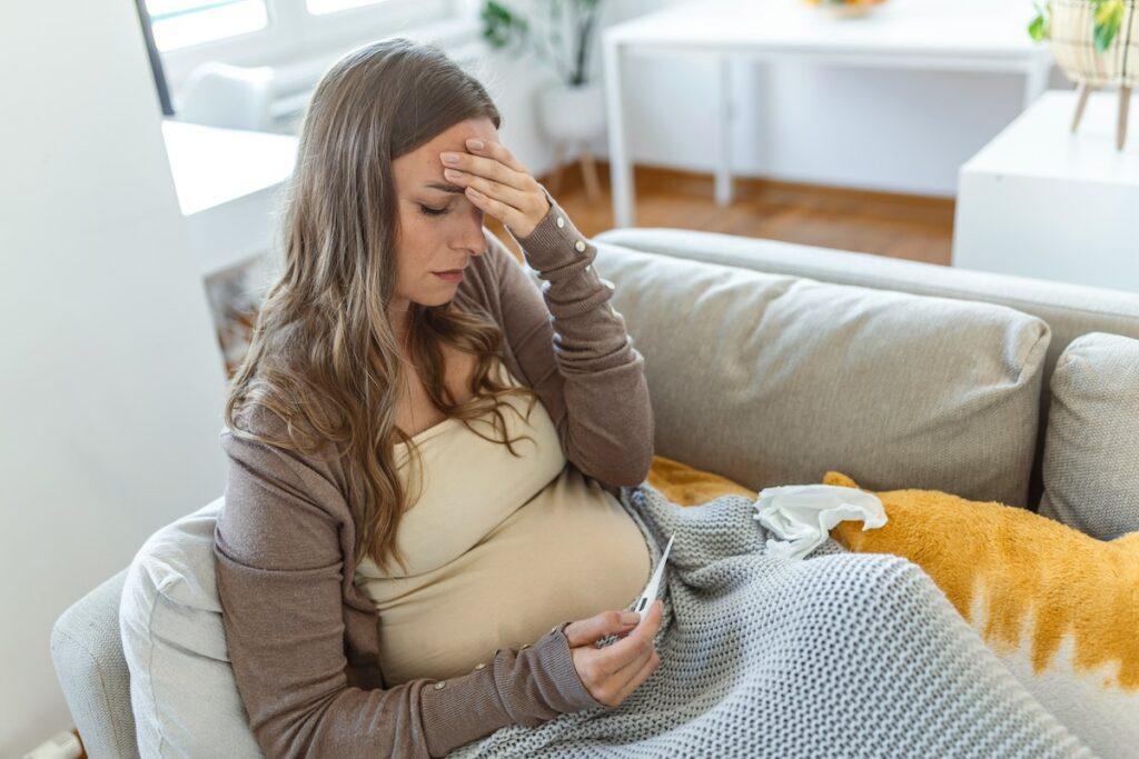 a pregnant woman is sick and taking tylenol for pain during pregnancy