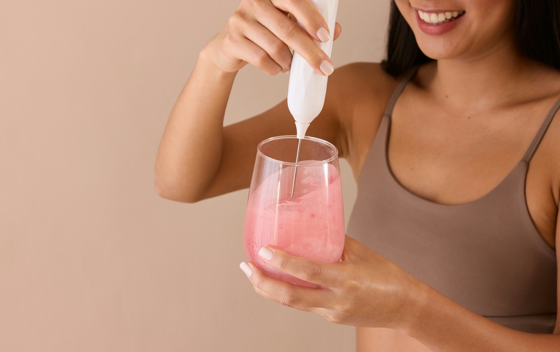 a woman mixes electrolytes, which is one of many healthy drinks besides water