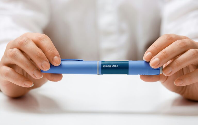 an older person holds wegovy because wegovy is now covered by insurance through medicare
