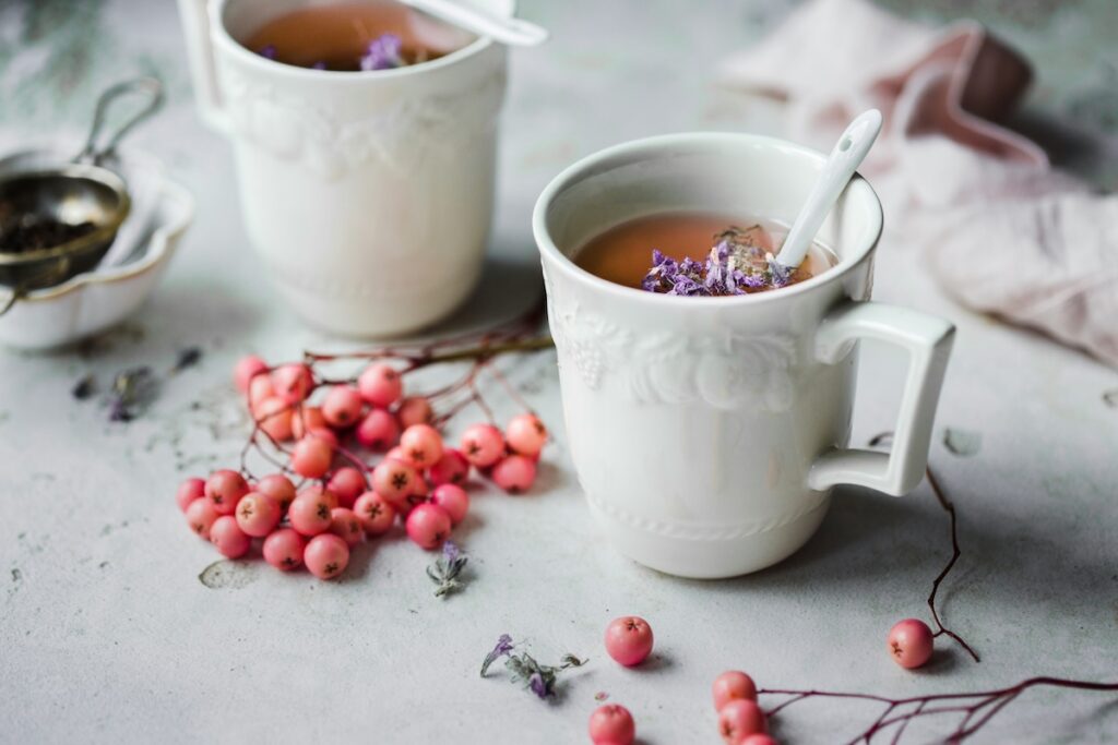 Herbal tea with fresh berries, a hydrating drink that supports how to restore gut health after alcohol