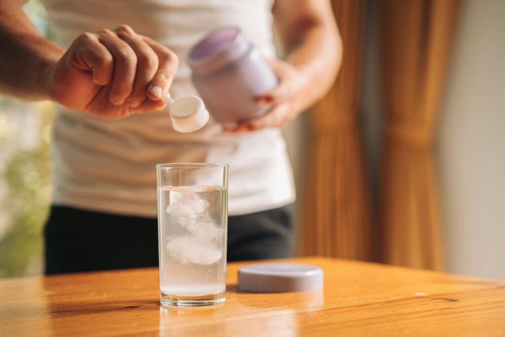 a woman drinks an electrolyte drink that does not break her fast