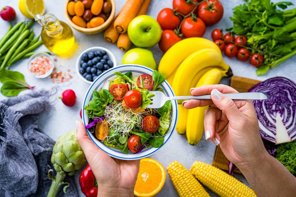 Fresh fruits, vegetables, and a fiber-rich salad — nutritious swaps for the worst foods for gut health