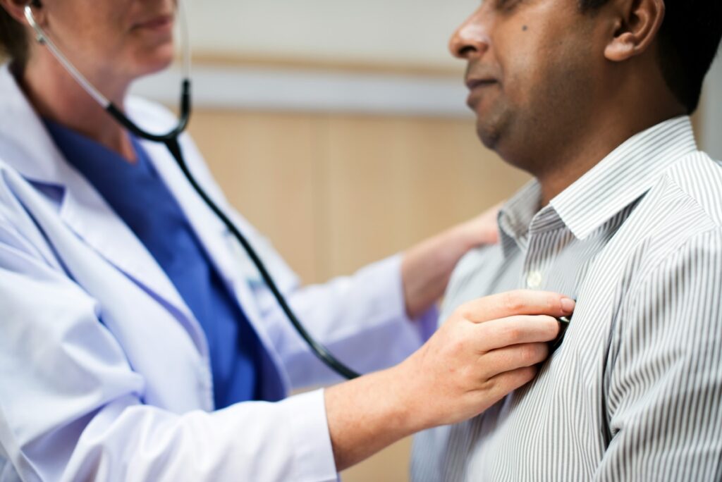 a man gets a heart check-up because microplastics can build up in your arteries