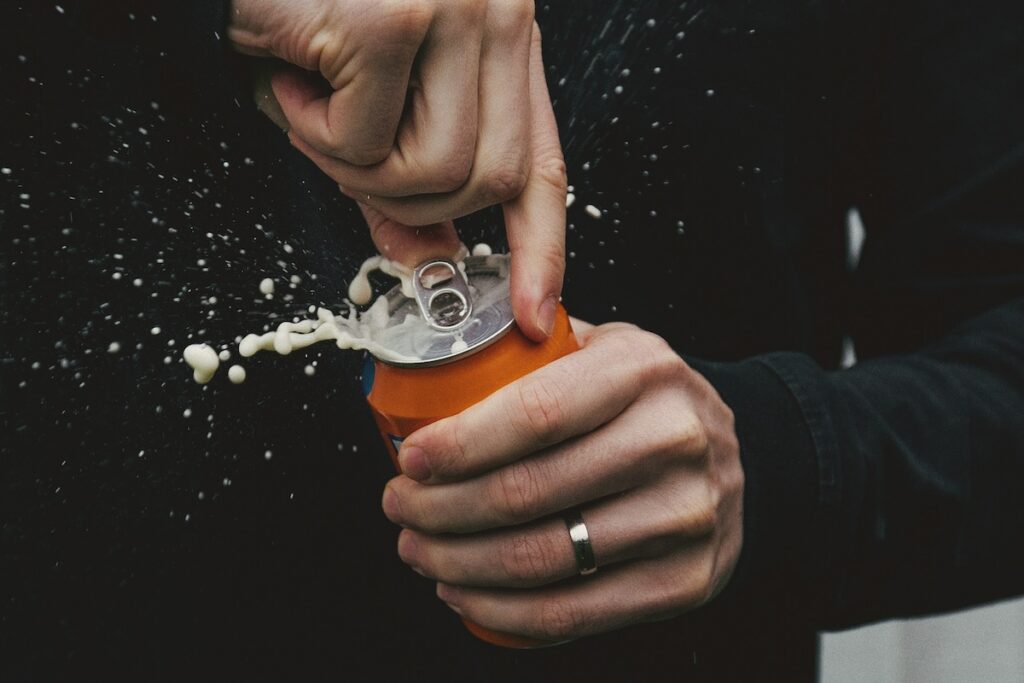 a man drinks a protein soda to get more protein without powder into his diet