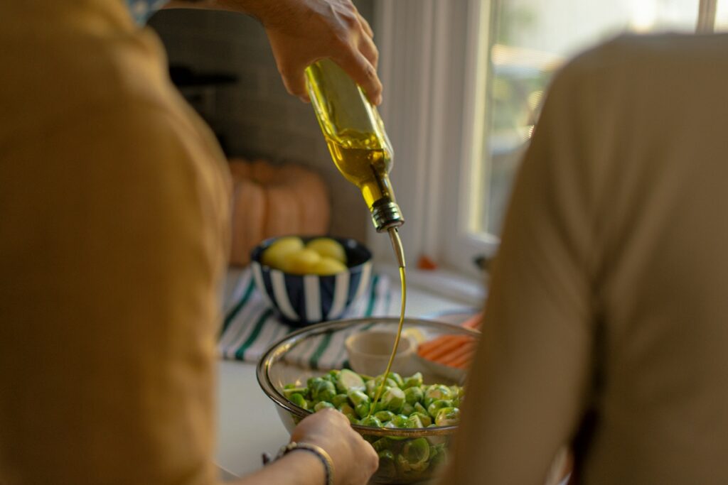 Olive oil drizzled over Brussels sprouts, a heart-healthy condiment for blood sugar that supports insulin sensitivity