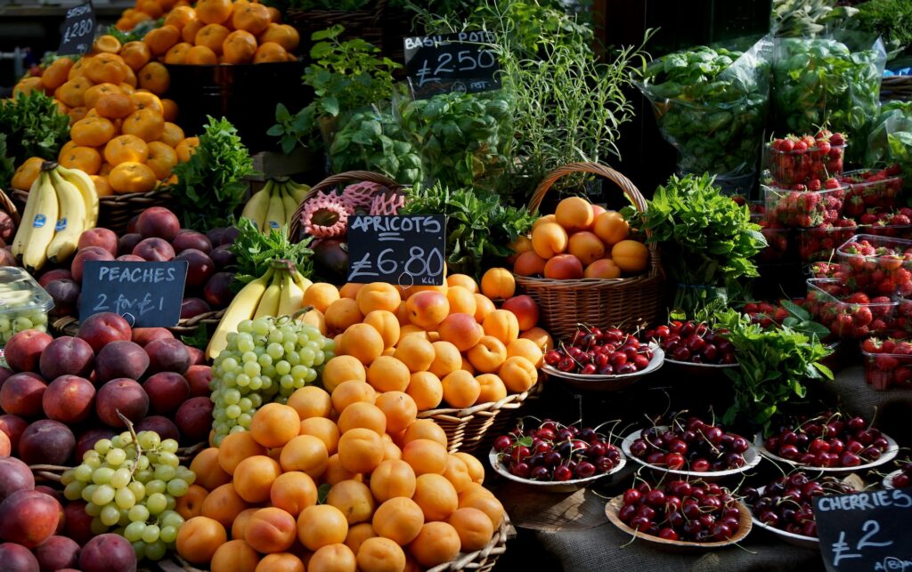 Fresh market produce including cherries and strawberries, flavanol-rich foods that support heart health