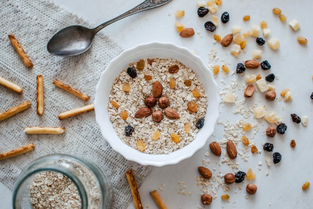 bowl of oats with nuts and dried fruit, a mix of high protein high fiber foods