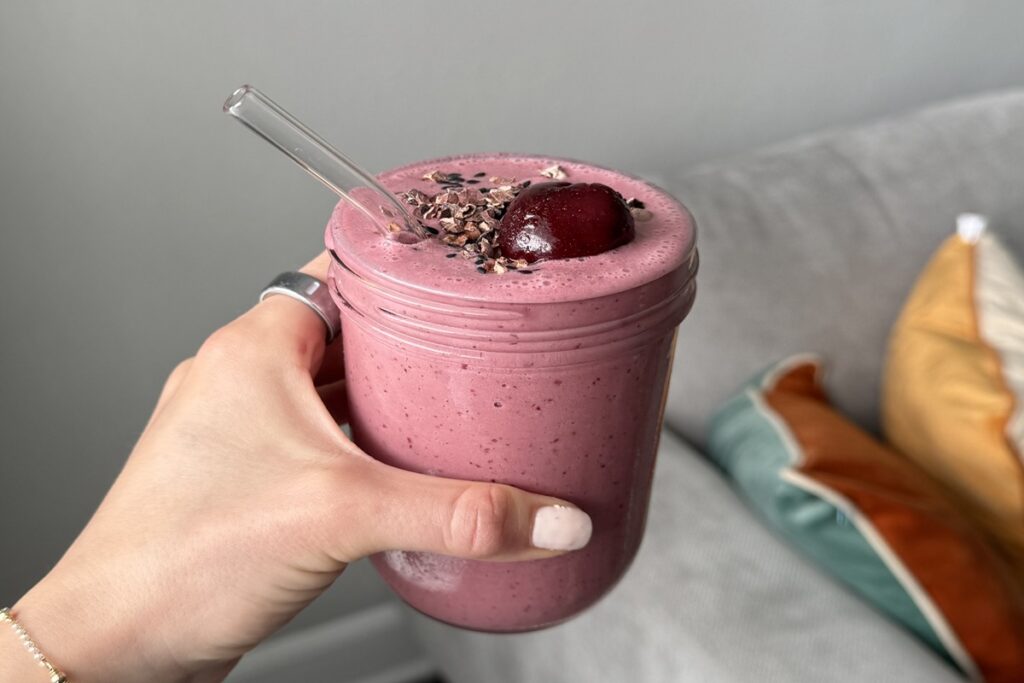 Cherry tahini smoothie topped with a cherry, cacao nibs, and sesame seeds, one of six simple healthy meals