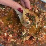 and dipping toasted bread into a no-cook Mediterranean dip of grated tomato, crumbled feta, Kalamata olives, and olive oil