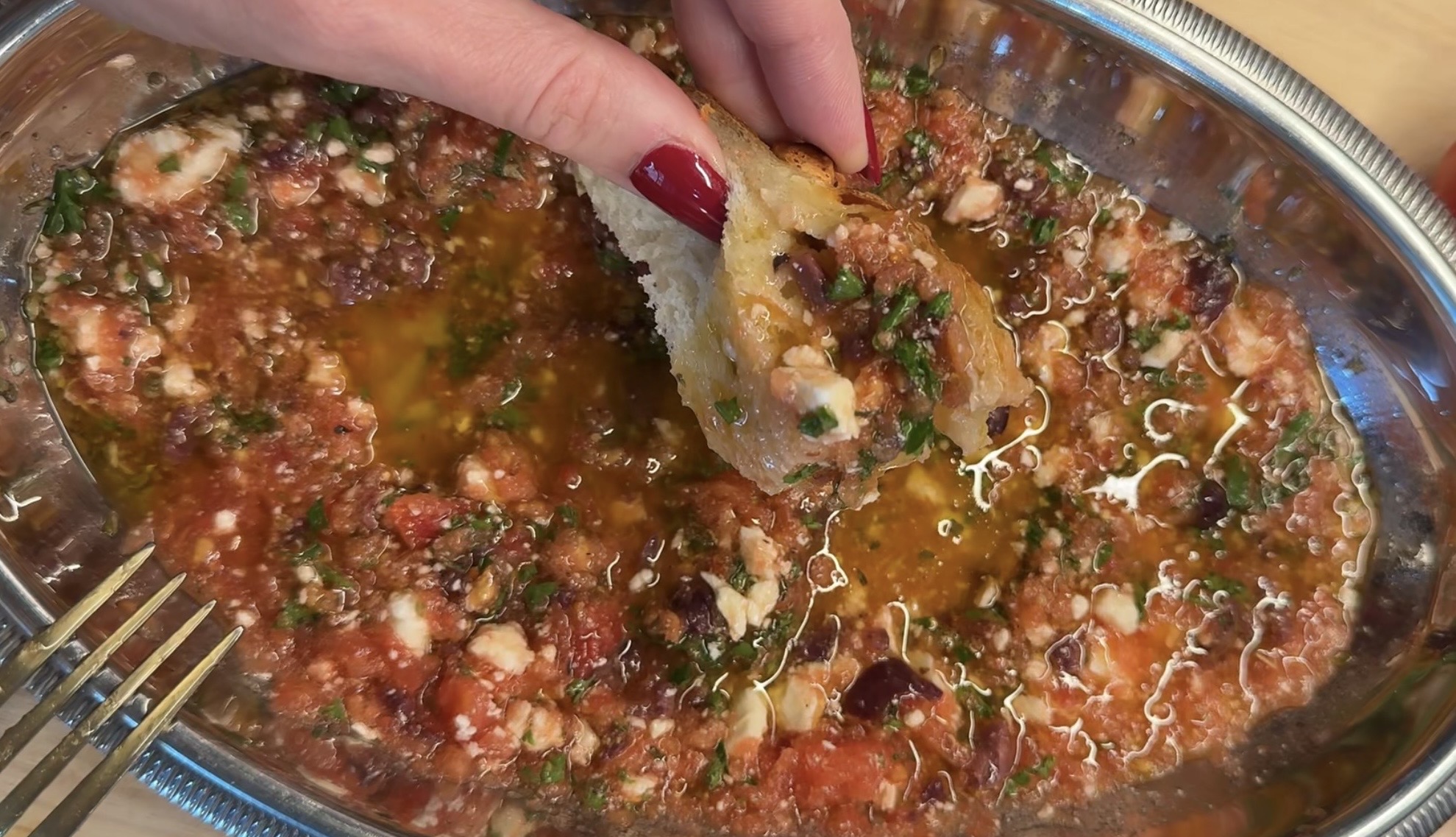 and dipping toasted bread into a no-cook Mediterranean dip of grated tomato, crumbled feta, Kalamata olives, and olive oil
