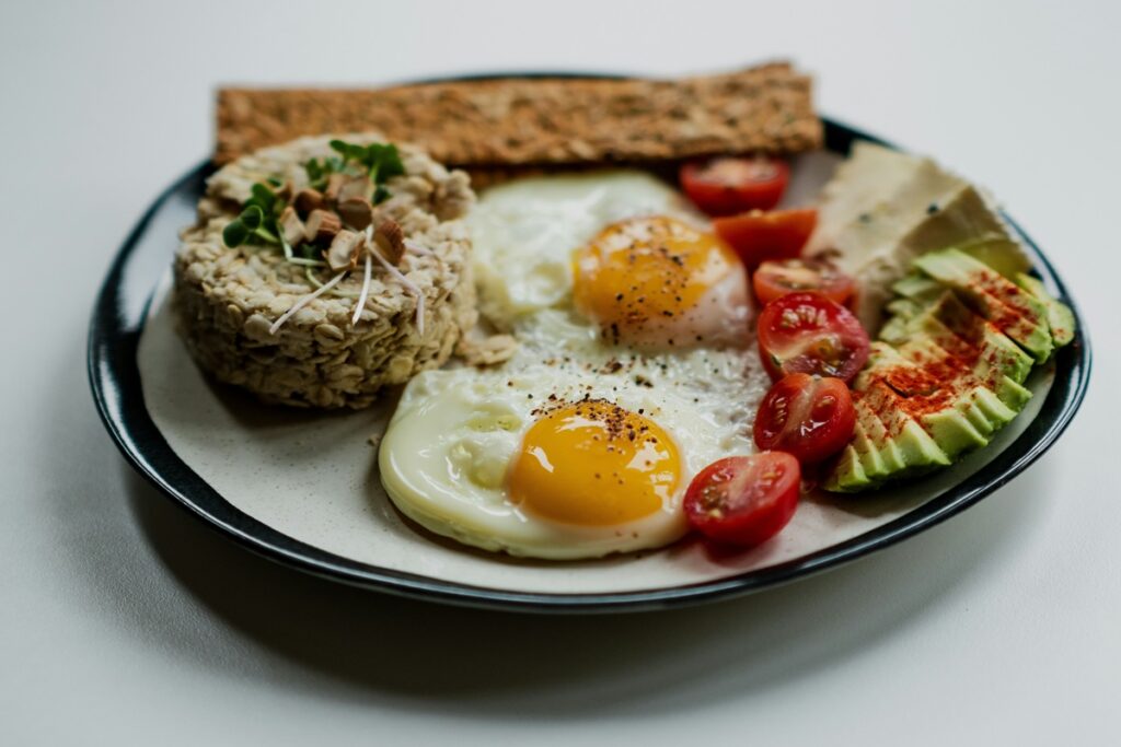 What does collagen do? A protein-rich plate of eggs, avocado, and tomatoes helps your body make it.