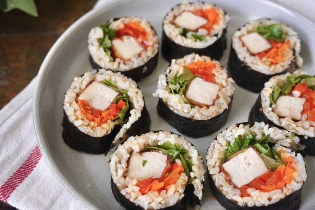 Tofu veggie kimbap slices with brown rice, carrots, and lettuce, one of six simple healthy meals