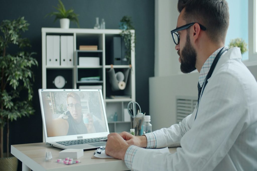 Doctor on a telehealth video call with a patient, a reminder that self-care ideas don’t replace professional medical care