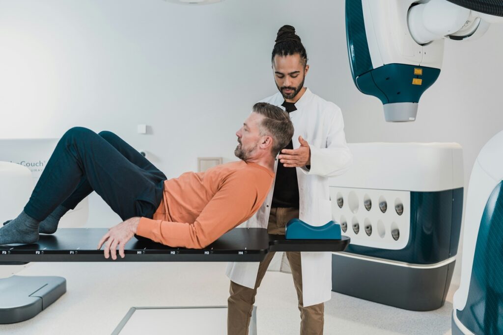 Doctor positioning a patient for a bone density scan, a test that shows how vitamin K2 for bones may help over time